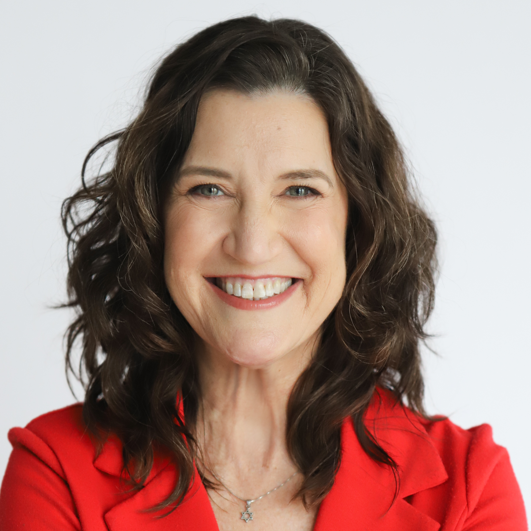 white woman with brown hair wearing a red shirt