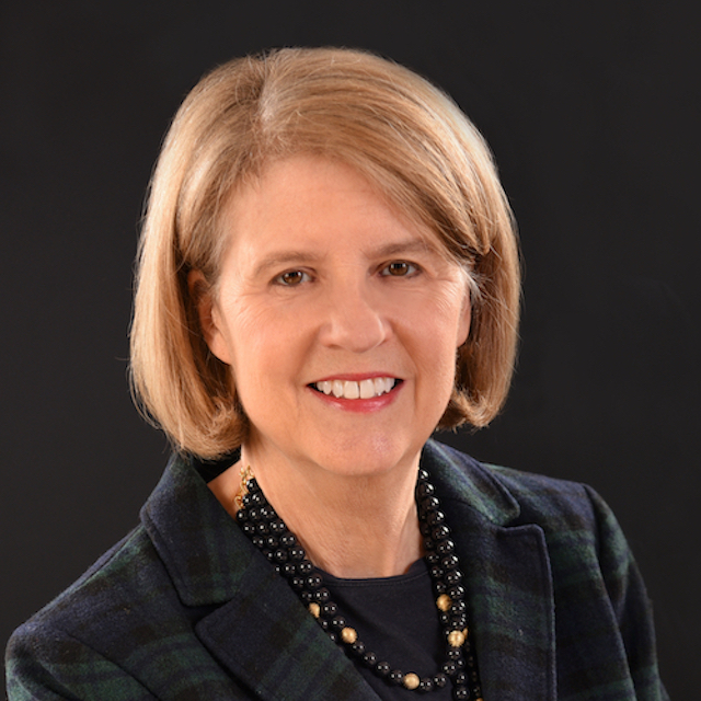 Sandra Long is a white woman with shoulder length blond hair and a big smile